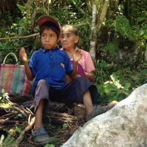 Grandmother and grandson, waiting in the shade for their solar systme