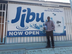 Charles in front of his franchise in Kimironko, Rwanda.