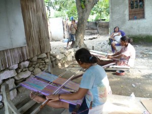 A women's tais collective in Dili, Timor-Leste. More advanced production equipment and training of marketing could help remove the 'middle-man' than many collectives must use (source: author).