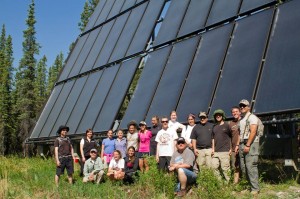 The Santa Clara group in front of solar panels at the Denali Education Center