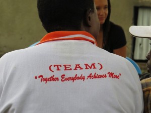 The Sango Bay Farmers' Association motto, displayed on of the farmer/entrepreneurs (Photo taken by Andrew Pascale)
