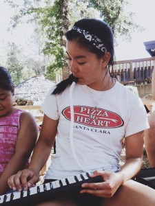 Playing the melodica with Dora at the Me-Wuk reservation.