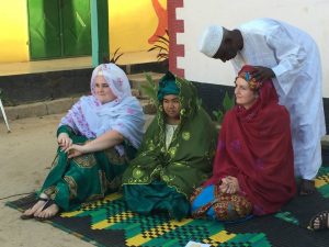 Participating in ritual naming ceremony in The Gambia.