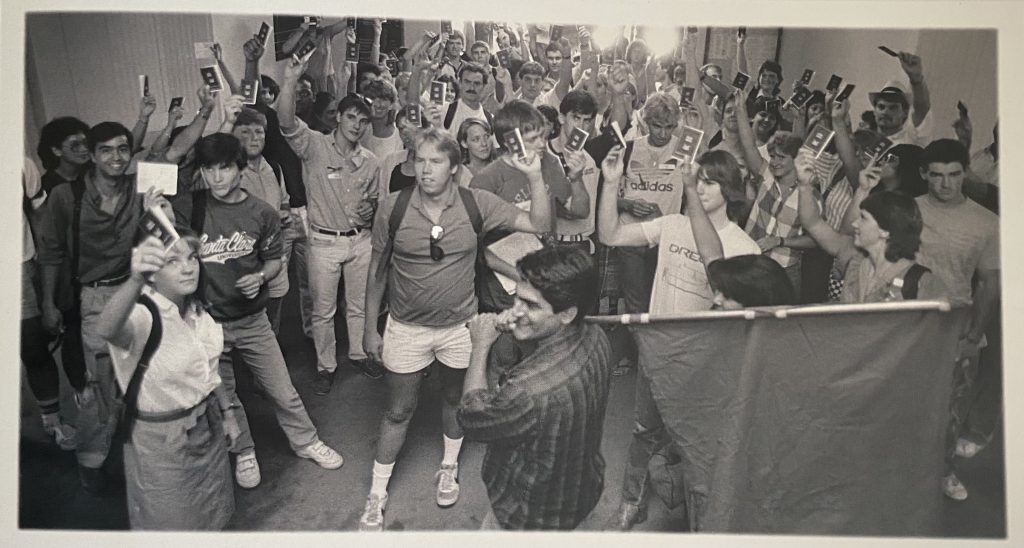 Students demonstrate in lobby of Administration Building to demand Santa Clara divest its holdings in companies with financial interests in South Africa, 1985
