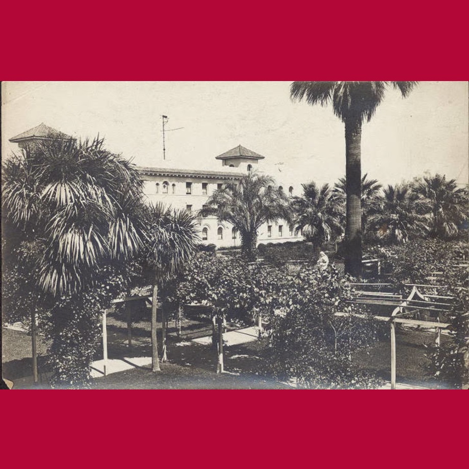 St. Joseph's Hall visible over the Mission Gardens archways