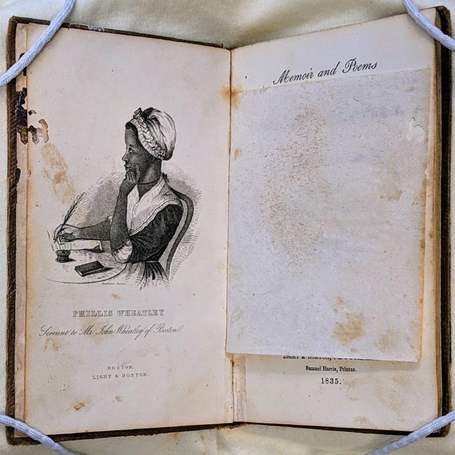 Portrait of Phillis Wheatley in profile, seated at a writing desk.