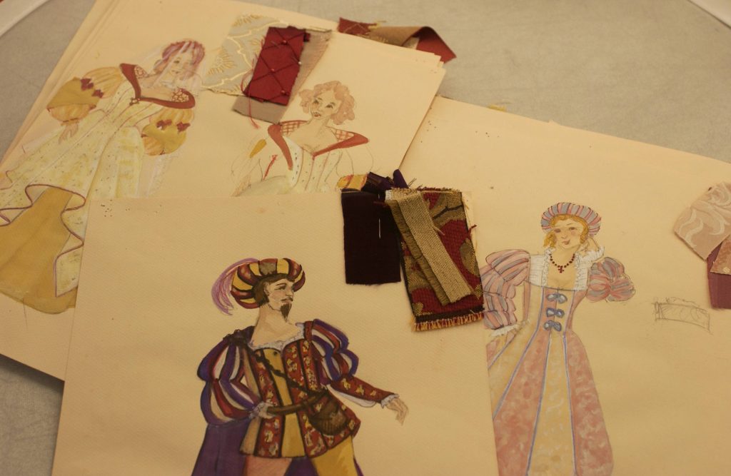 Color sketches of Renaissance clothing and fabric samples. 