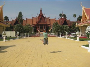 Jumping for joy in front of some incredible architecture in Phnom Penh 