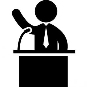 man-talking-on-business-presentation-behind-a-podium-with-a-mic_318-62429