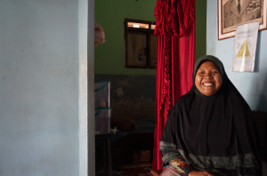 One of Nazava's resellers sitting proudly in her home, smiling during her interview.