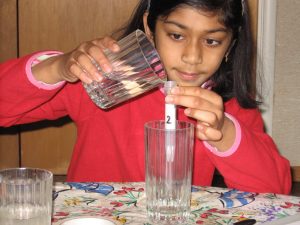 Conducting a science experiment for a middle school project. Practicing medicine is a professional goal of mine for the future.