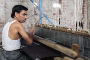 This is a hand-operated loom in action in Napasar.