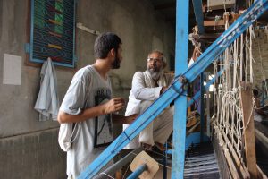The site manager at Napasar patiently tried to explain the magical handwork produced on site.