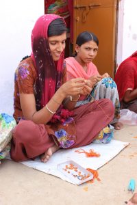 This young apprentice was learning about craftwork in preparation for her own future. The artisans in Bikaner and Barmer were well aware of their family's financial situations and were dedicated to doing whatever was best for their household. 