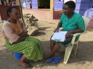 Here, Revina is conducting an interview with a Solar Sister customer.